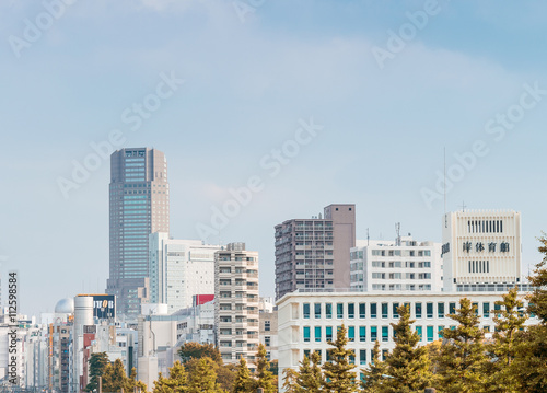TOKYO - JUNE 1, 2016: Buildings of Jinnan and Shibuya over railw