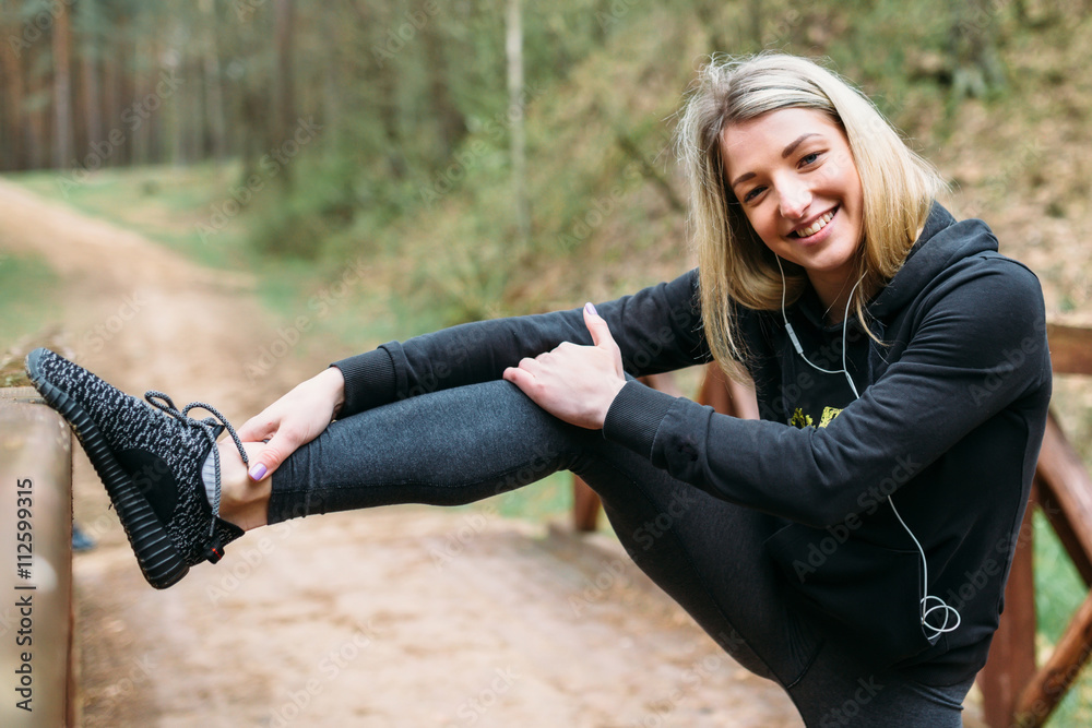Girl with an athletic figure engaged in a park Girl with an athletic figure engaged in a park