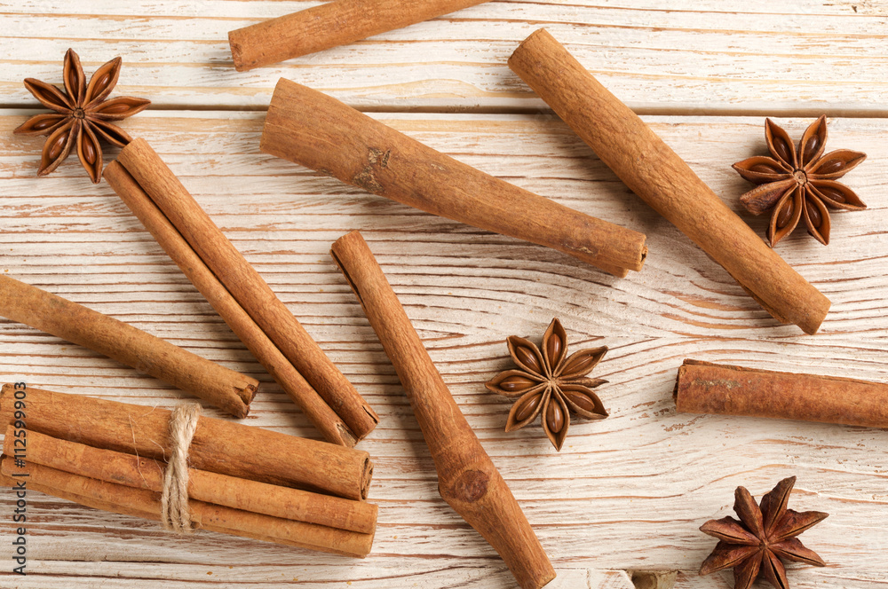 cinnamon and star anise on a wooden background cinnamon and star anise on a wooden background