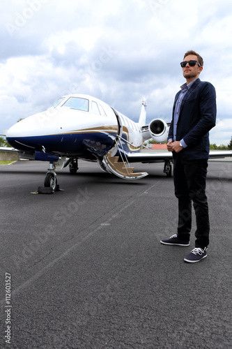 Young man and business jet © ondrejschaumann