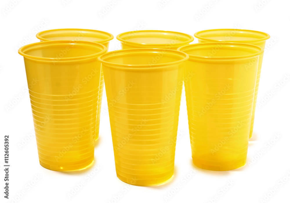 Yellow plastic glasses on a white background Yellow plastic glasses on a white background