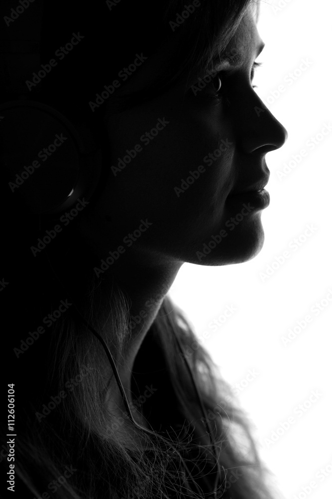 silhouette of a woman with headphones silhouette of a woman with headphones