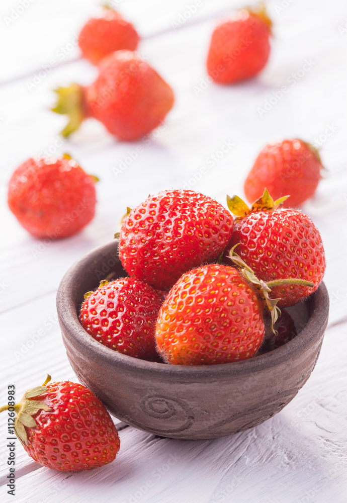 Fresh red strawberries with cream on the white wooden table. Fresh red strawberries with cream on the white wooden table.