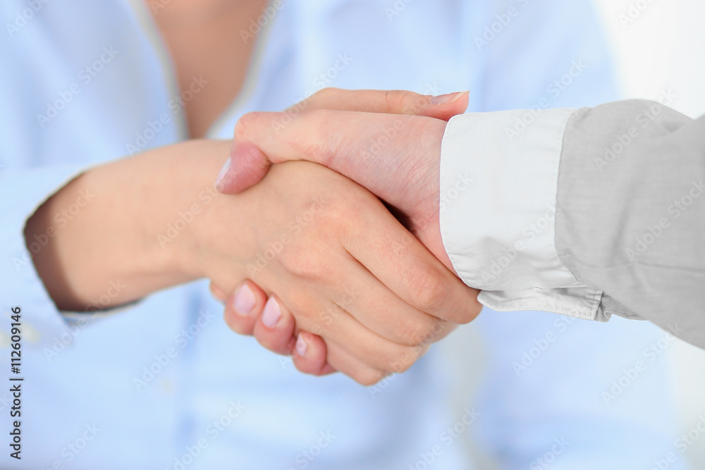 Business people shaking hands, finishing up a meeting Business people shaking hands, finishing up a meeting