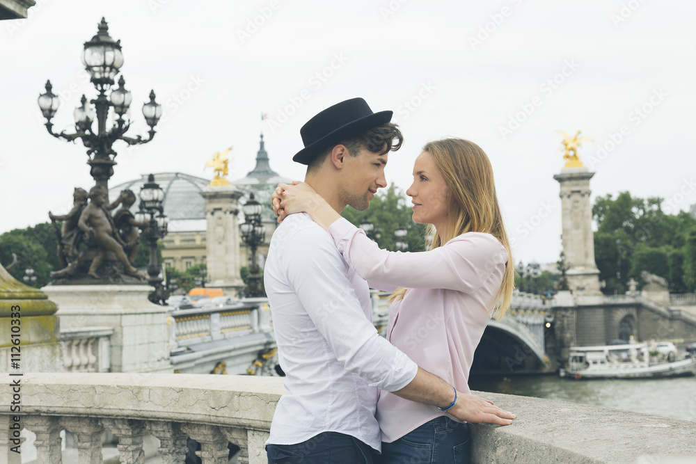 Fototapeta premium Young couple dating in Paris