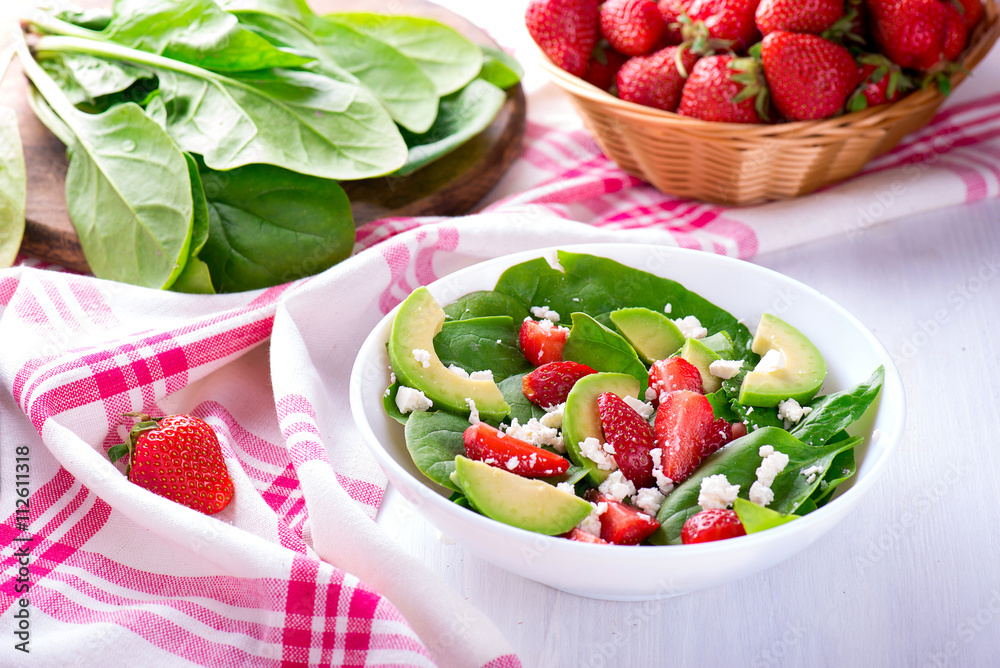 Summer salad with strawberry, avocado and spinach Summer salad with strawberry, avocado and spinach