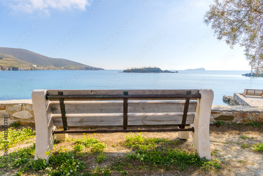 Traditional bench by the sea in Syros, Cyclades, Greece.