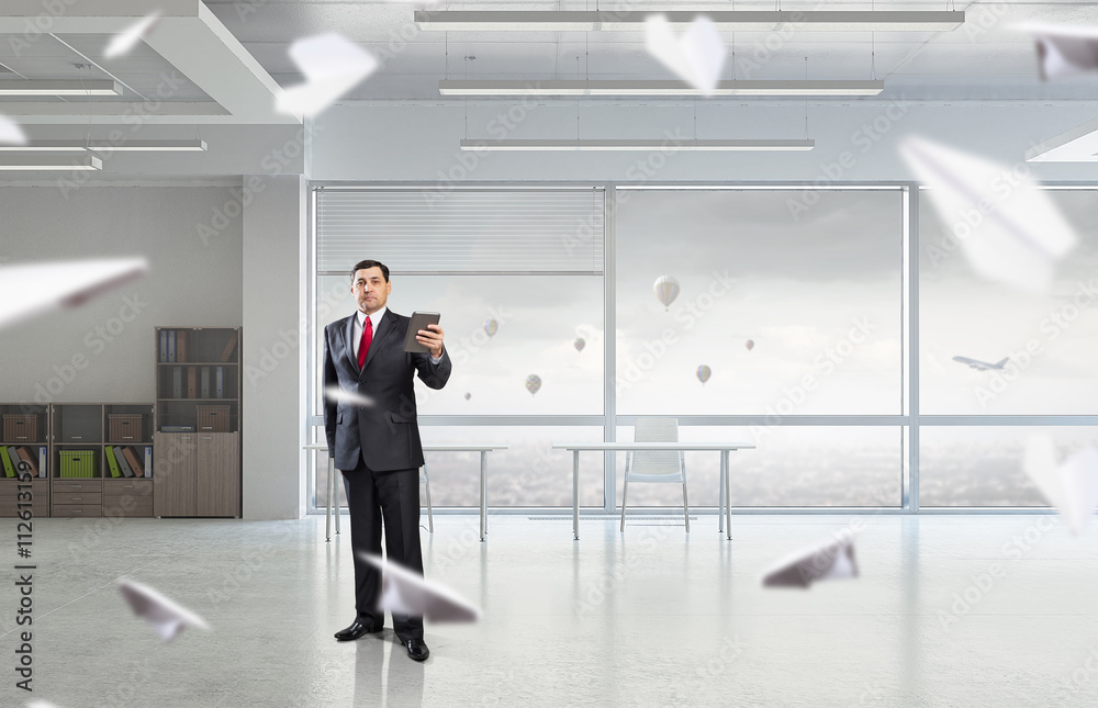 Businessman with tablet in hand Businessman with tablet in hand