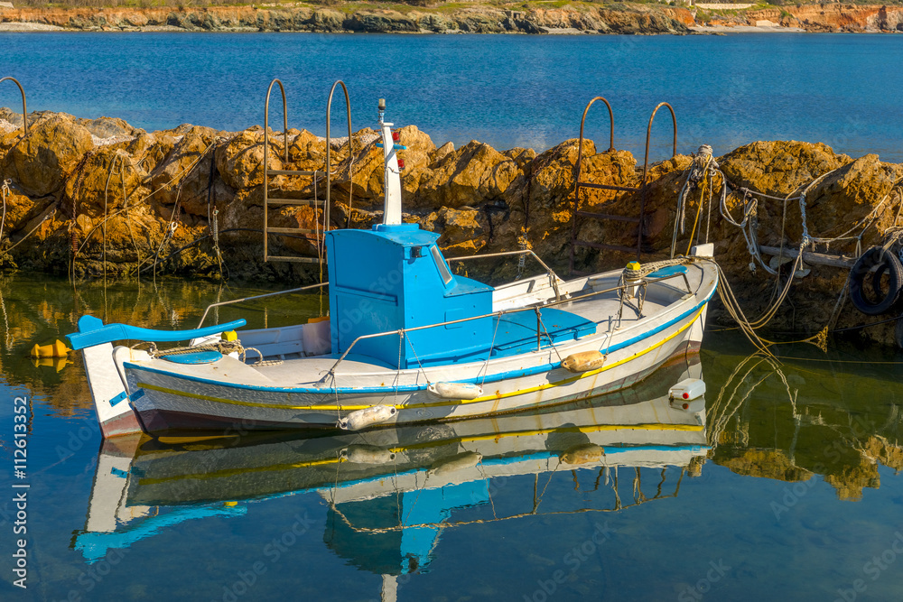 Traditional fishing boats in Cyclades, Greece. Bright sunlight r