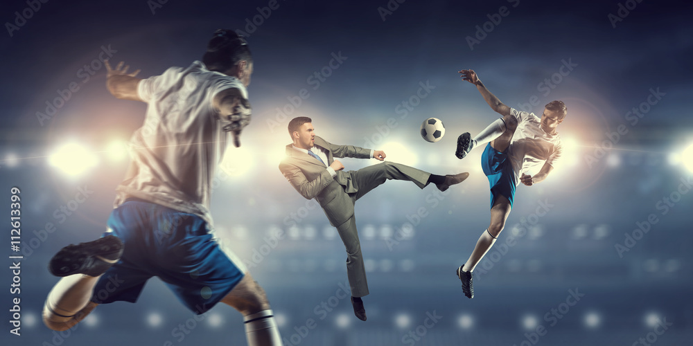 Fototapeta premium Businessman and player fighting for ball
