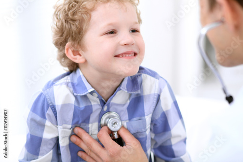 Doctor examining a child patient by stethoscope