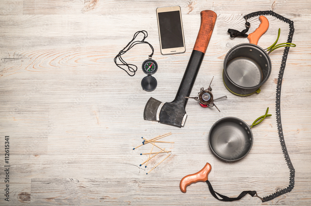 Items for travel. Set of travel accessories on wooden background
