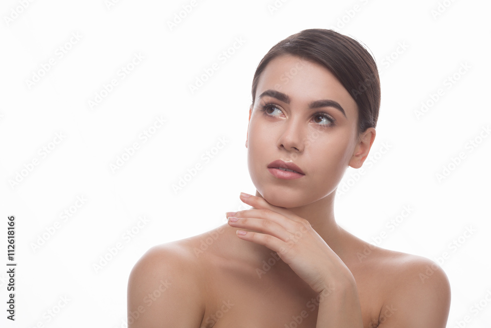 Studio closeup shot for cosmetic surgery magazine over white background. Beautiful lady looking away and touching her face. Studio closeup shot for cosmetic surgery magazine over white background. Beautiful lady looking away and touching her face.