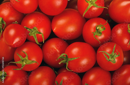 Red cherry tomatoes background