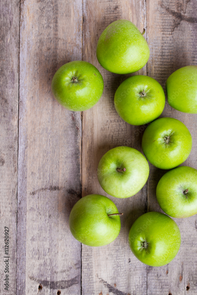 green apples on wood