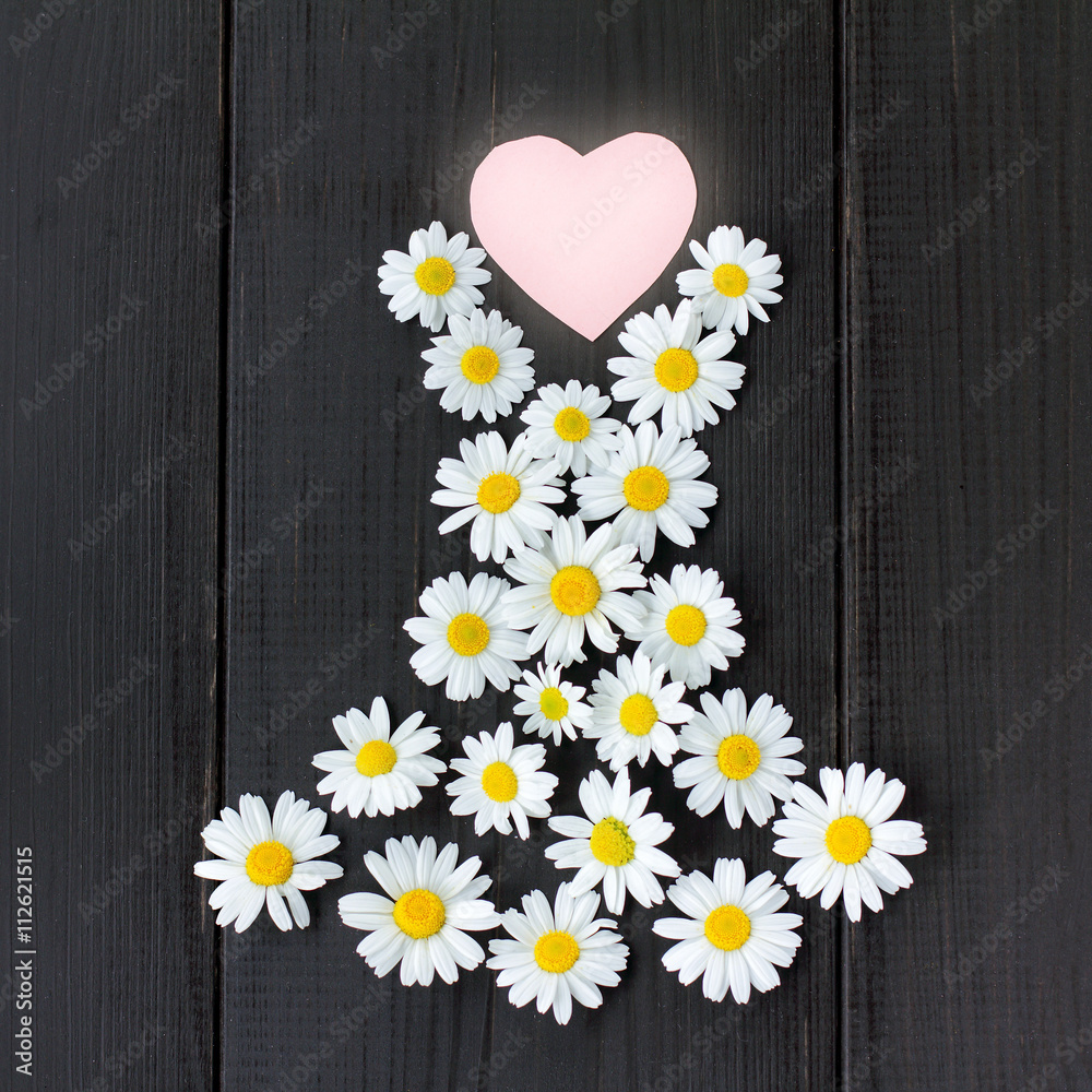 Obraz premium fashionable floral dress from your favorite collection/ flat lay of your favorite summer dress daisies with heart symbol on wooden background