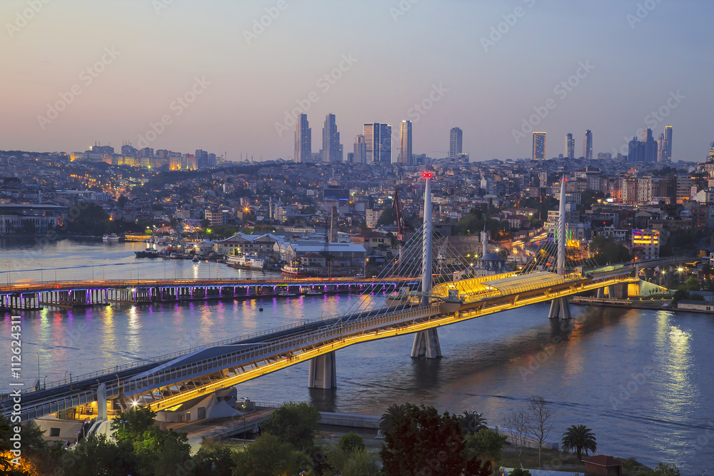 Ataturk bridge, metro bridge and golden horn at night - Istanbul, Turkey