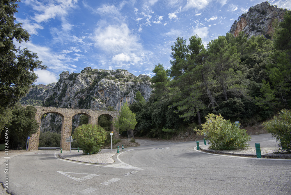 Old stone bridge above highway in Mallorca Spain Old stone bridge above highway in Mallorca Spain