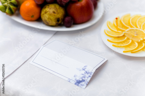 White place card decorated on festive table