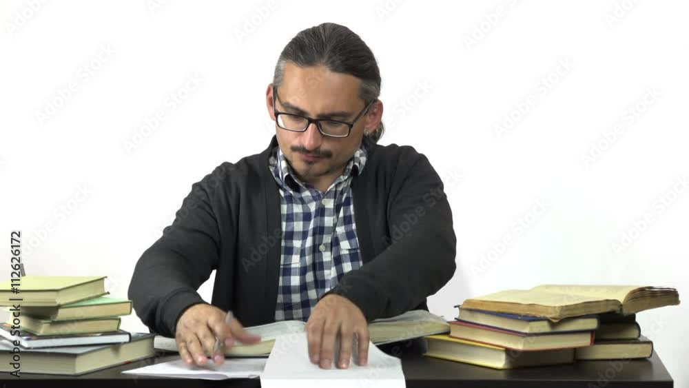 irritated man sitting at table and can not solve the task. 4k people stock footage clip at white background.
irritated man sitting at table and can not solve the task. 4k people stock footage clip at white background.