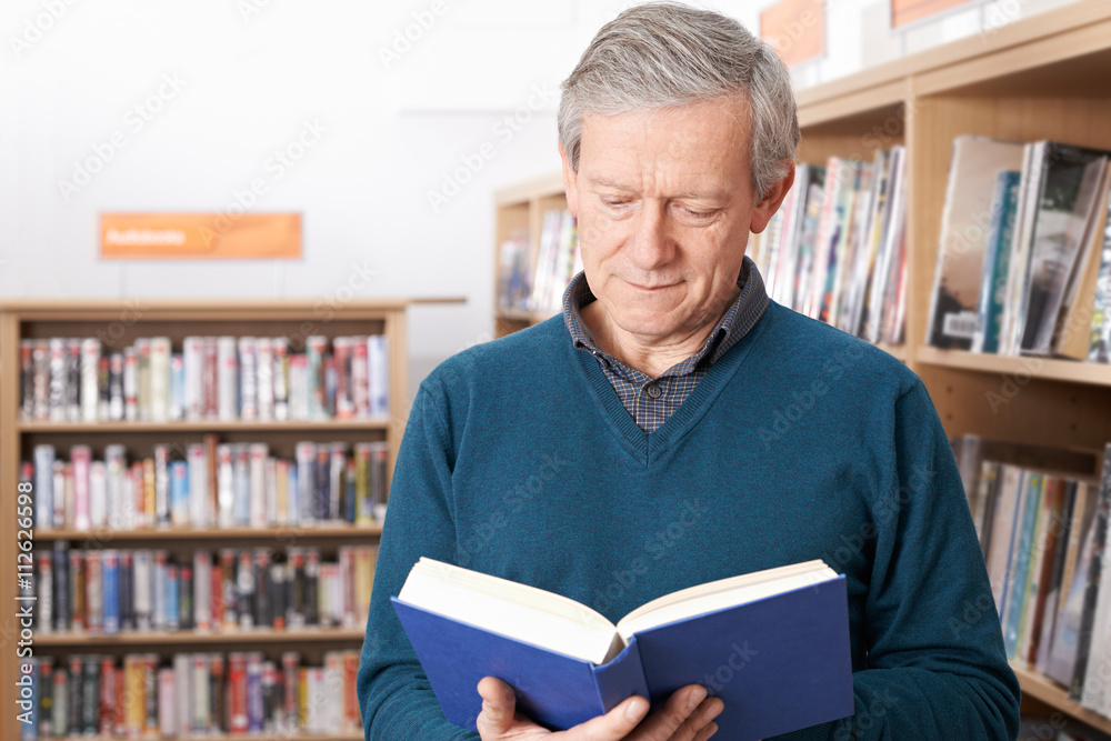 Mature Male Student Studying In Library Mature Male Student Studying In Library