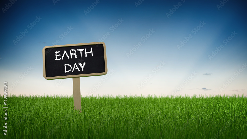 Sign with Earth Day text in grass
