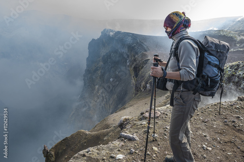 Italy, Sicily, Mount Etna, tourist looking in crater photo