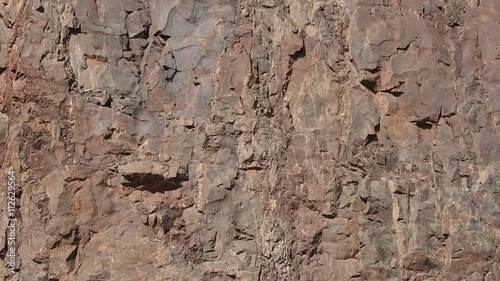 view in an open pit mine quarry. porphyry rocks. camera pan.