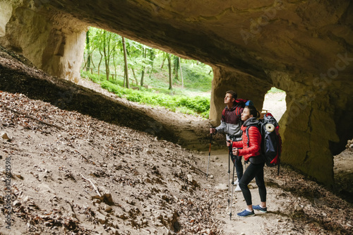Serbia, Rakovac, young couple hiking, cave, abandoned quarry photo