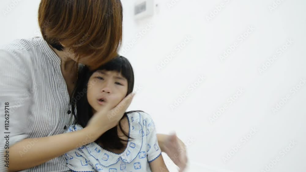 Mother comforting her crying little girl - parenthood concept Mother comforting her crying little girl - parenthood concept