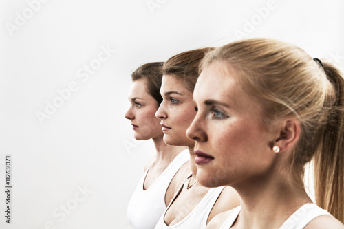 Row of three young athletes photo