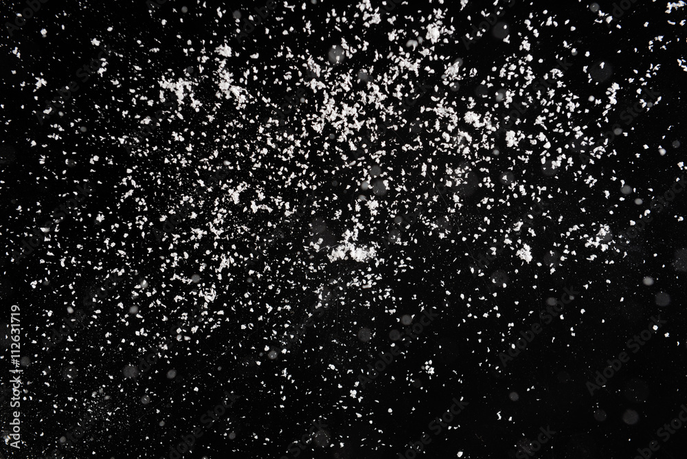 Fototapeta premium Snow flakes on dark background