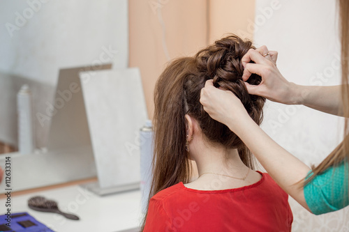 closeup of hands doing hair