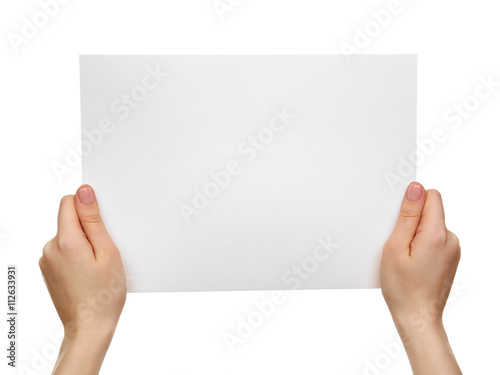 Female hands holding blank sheet of paper isolated on white