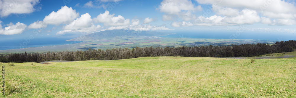 View of the plain between Kahului and Maalaea Bay seen from the lower slopes of Haleakala. The plain divides Maui in two.