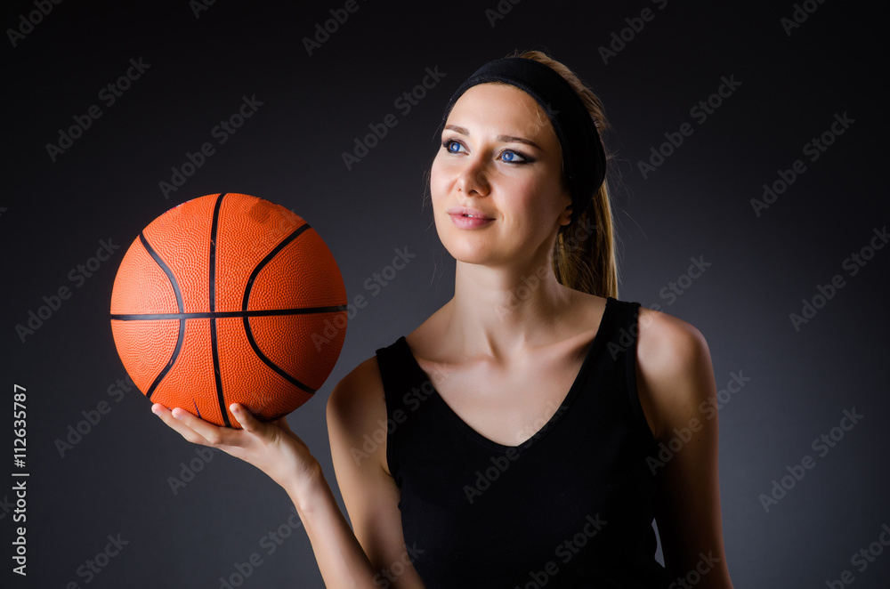 Woman with basketball in sport concept