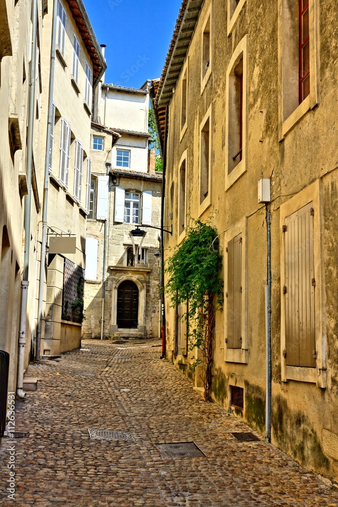 Traditional old street in the historic center of Avignon, Provence, France