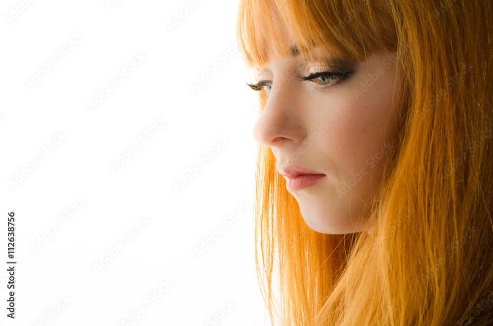 Naklejka premium Beautiful young happy woman with long flowing red hair 