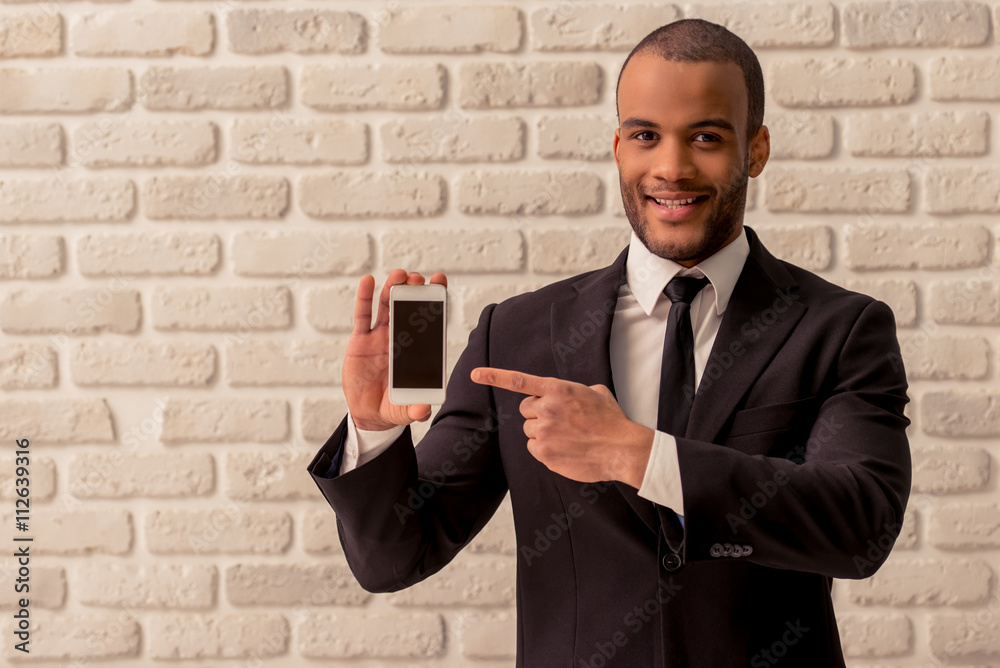 Afro American businessman with gadget Afro American businessman with gadget