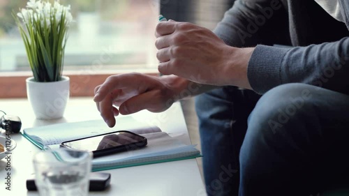 Close up of a man using mobile smart phone