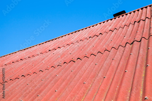 Blue sky and red roof  background photo