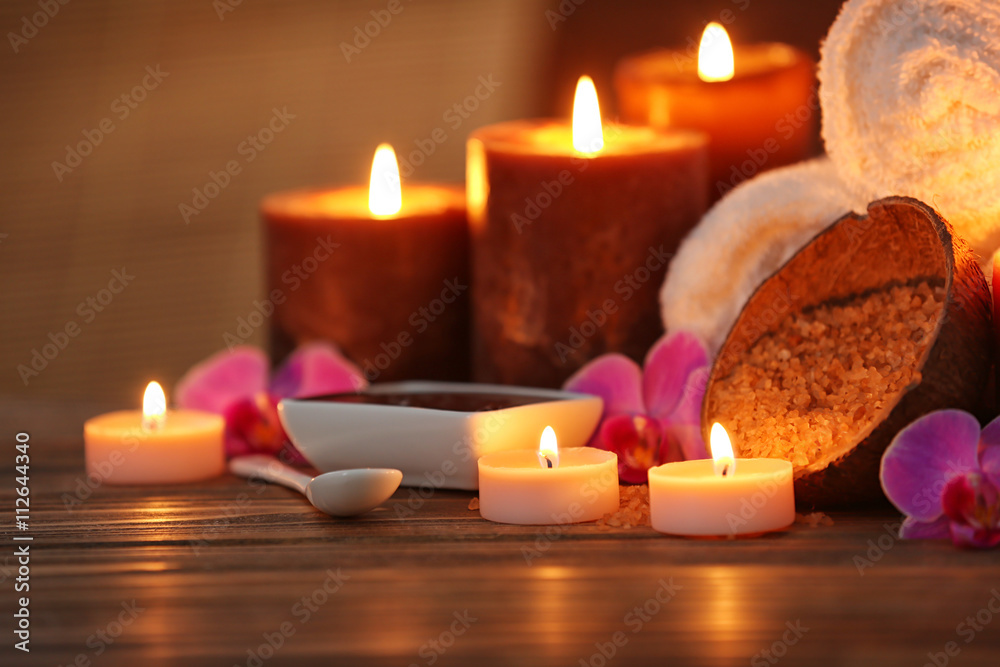 Spa composition with candles on brown background Spa composition with candles on brown background
