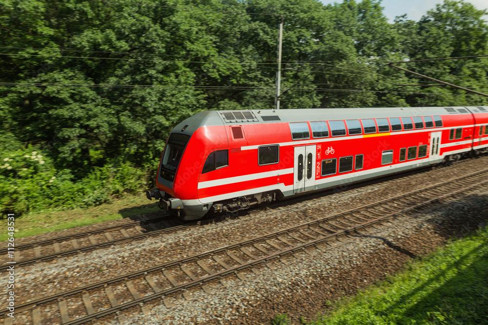 Naklejka premium Red train is on the track in Saxony