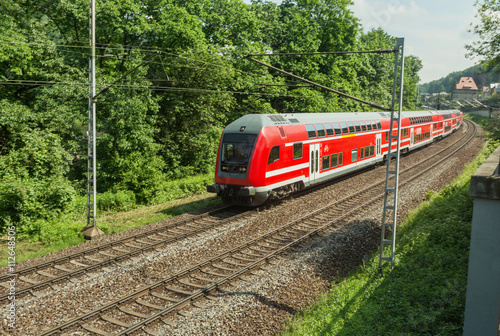 Red train is on the track in Saxony