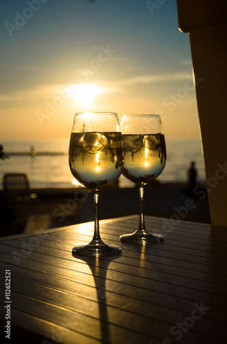 two glasses of wine and sunset