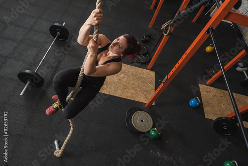 Female Fitness Trainer on the Rope