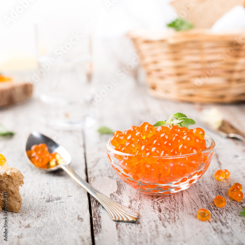 Glass bowl with red caviar