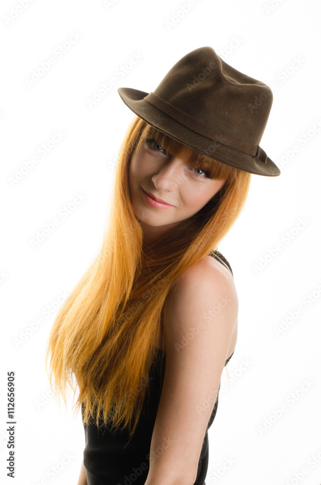 beautiful red-haired girl with a hat in the studio beautiful red-haired girl with a hat in the studio