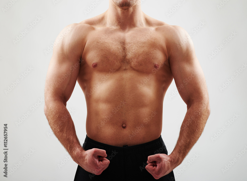 Close-up of bare male torso on white background Close-up of bare male torso on white background