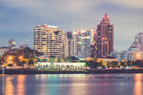 Bangkok city downtown at night with reflection of skyline, Bangk